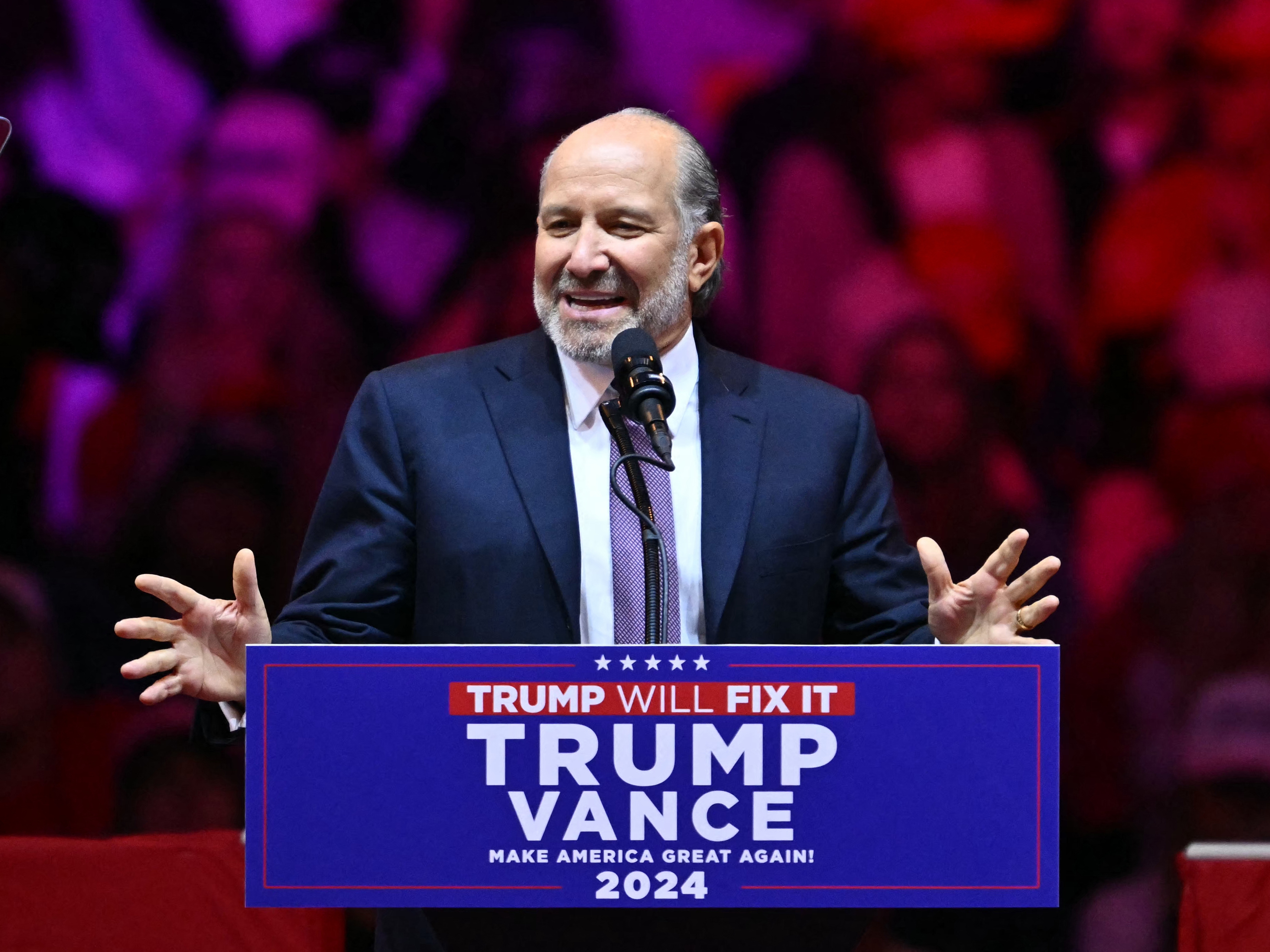caption: Howard Lutnick, Chairman and CEO of Cantor Fitzgerald, speaks at a rally for president-elect Donald Trump at Madison Square Garden in New York on Oct. 27, 2024.