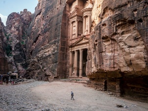 caption: Tour guide Mohammad Awwad by the Treasury in Petra, Jordan's biggest tourist destination.