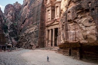 caption: Tour guide Mohammad Awwad by the Treasury in Petra, Jordan's biggest tourist destination.