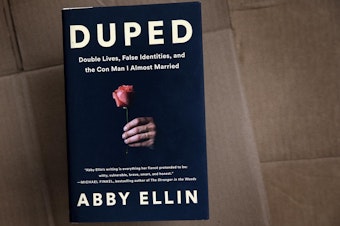 caption: "Duped: Double Lives, False Identities, and the Con Man I Almost Married," by Abby Ellin. (Robin Lubbock/WBUR)