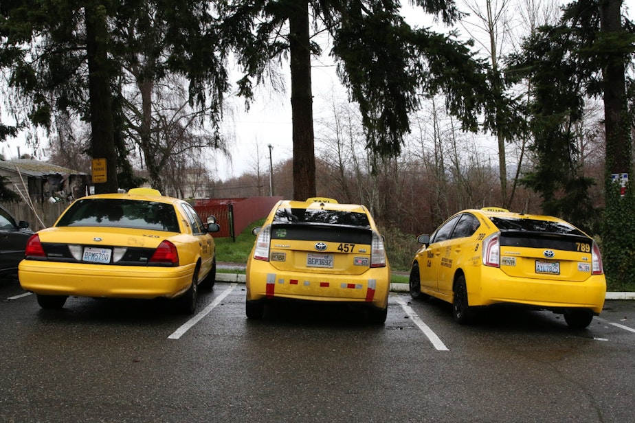 caption: Taxicabs at the Seattle Yellow Cab offices in Tukwila