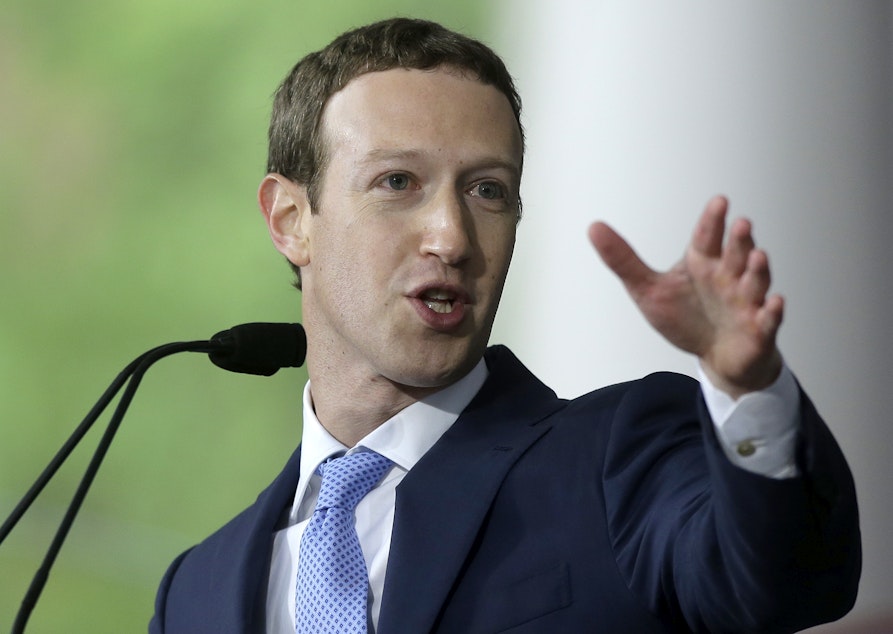 caption: FILE - In this May 25, 2017, file photo, Facebook CEO Mark Zuckerberg delivers the commencement address at Harvard University in Cambridge, Mass. 