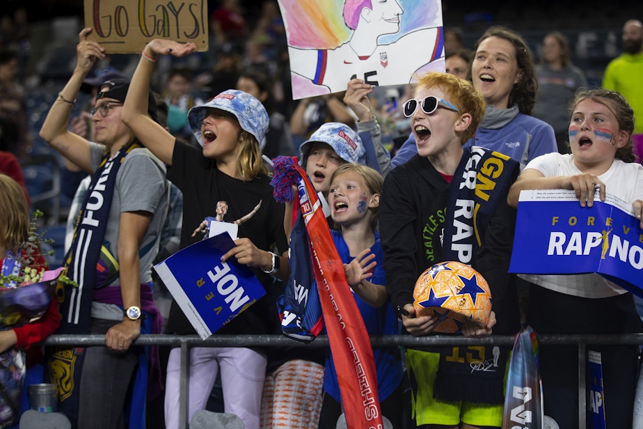 caption: Young fans hope for an autograph from OL Reign forward Megan Rapinoe during her last regular-season NWSL home game against the Washington Spirit on Friday, October 6, 2023, at Lumen Field in Seattle.