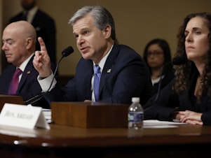 caption: Federal Bureau of Investigation Director Christopher Wray testifies before the House Homeland Security Committee on Tuesday. Homeland Security Secretary Alejandro Mayorkas and National Counterterrorism Center Director Christine Abizaid were also there to discuss threats to the U.S.