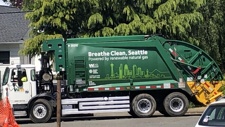 caption: A Waste Management garbage truck claims to be running on renewable fuel in Seattle in May 2022.