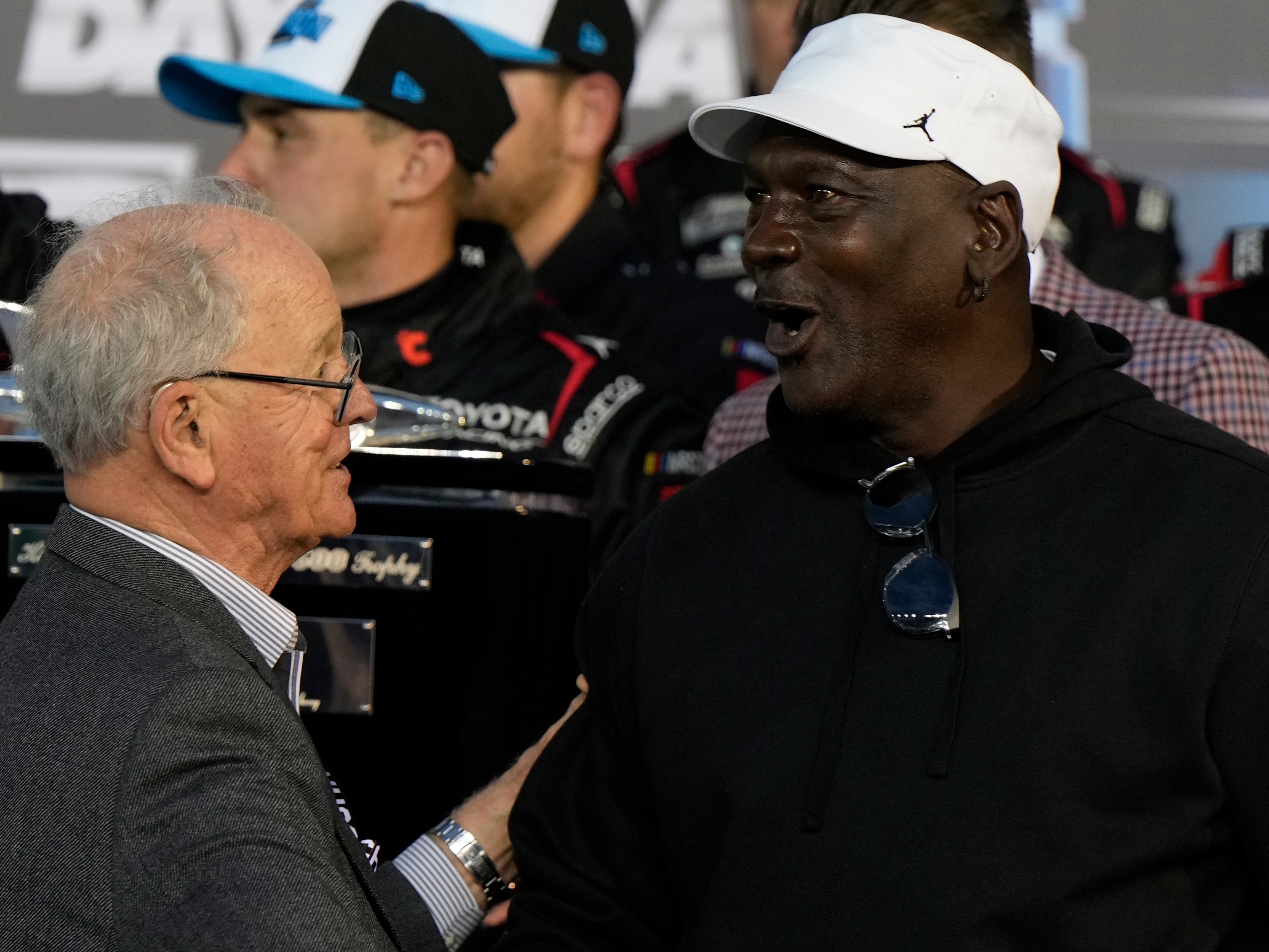 caption: 23XI Racing owner Michael Jordan speaks with CEO and Chairman of NASCAR, Jim Frantz after Tyler Reddick won the NASCAR Daytona 500 auto race at Daytona International Speedway, Sunday, Feb. 15, 2026, in Daytona Beach, Fla.