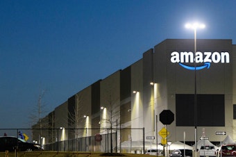 caption: The Amazon.com, Inc. BHM1 fulfillment center is seen before sunrise on March 29, 2021 in Bessemer, Alabama. Amazon announced it is ending its charity donation program, AmazonSmile.
