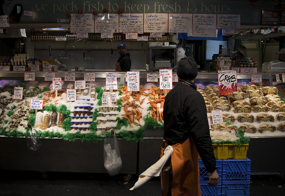 caption: Seafood is displayed at Pike Place Fish Market on Tuesday, January 9, 2018, at Pike Place in Seattle.