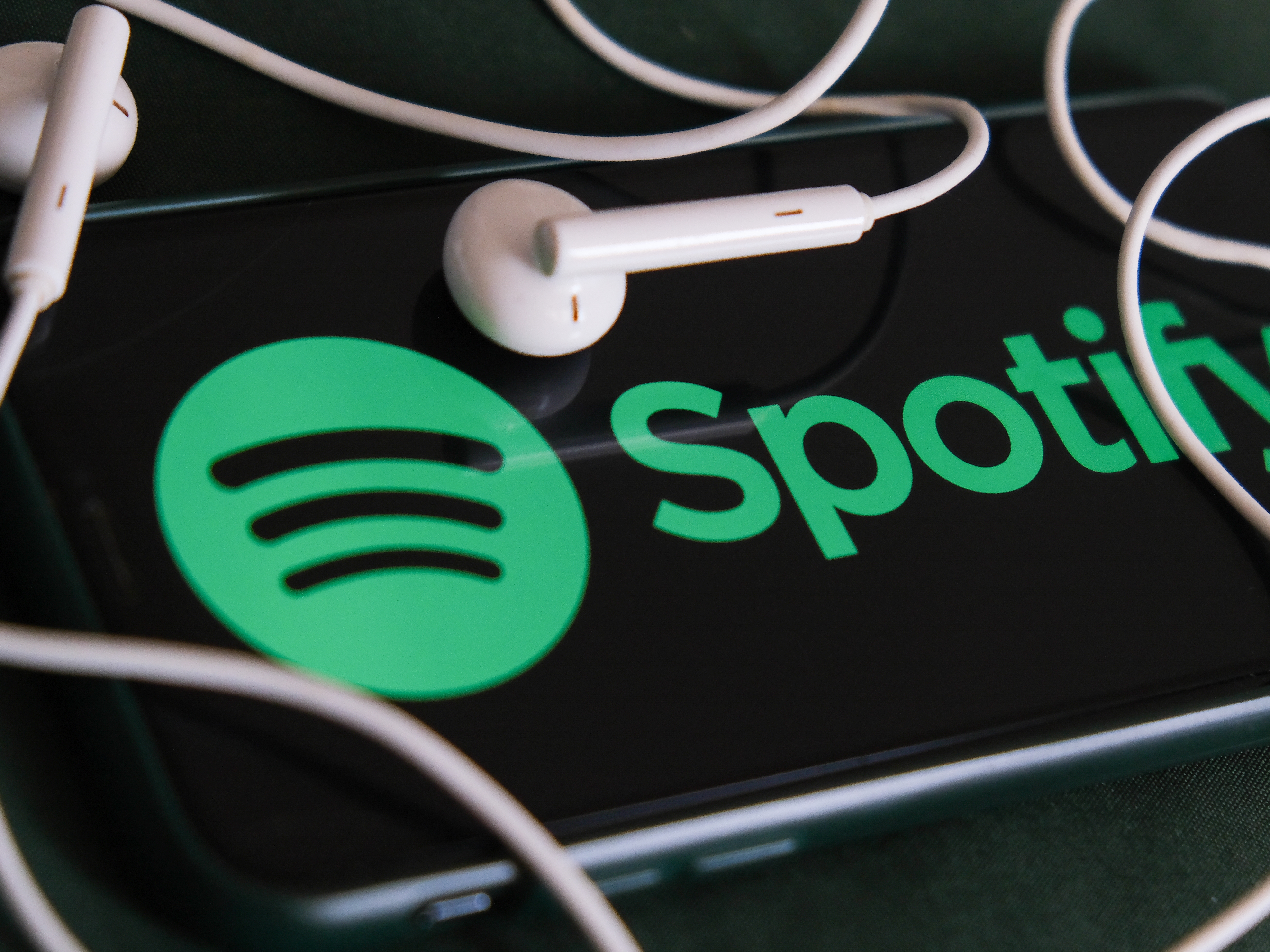 caption: Unlike other tech giants — including YouTube, Meta and TikTok — Spotify is not currently taking steps to label AI-generated content.