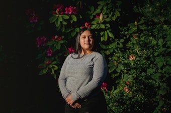 caption: Michelle Aguilar Ramirez stands for a portrait on May 18, 2020, in Seattle. 