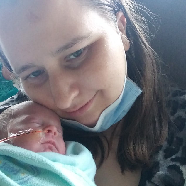 caption: Kristina Wiltse holds her daughter Aurora in the newborn ICU at the University of Washington.