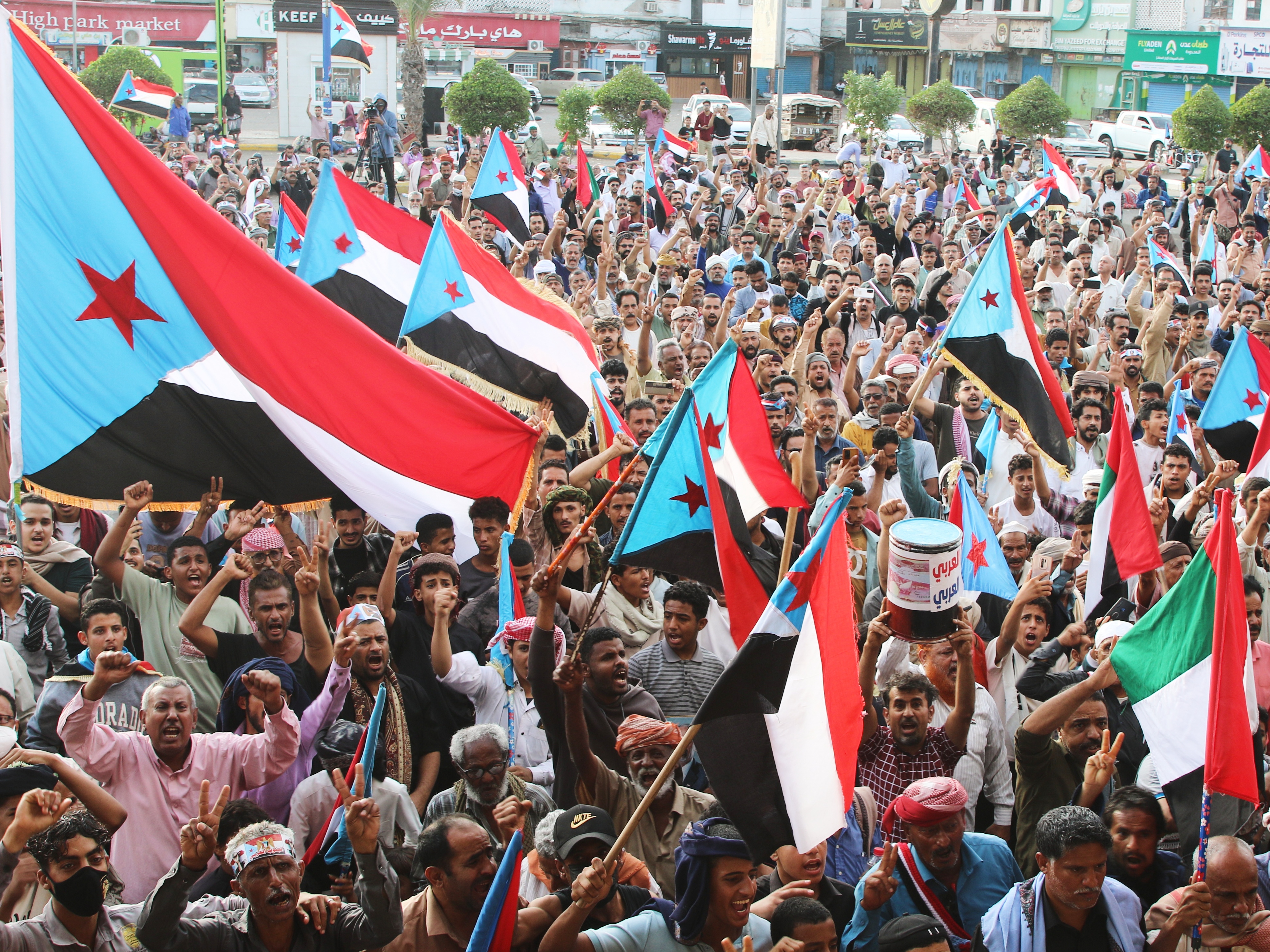 caption: Supporters of the Southern Transitional Council (STC), a coalition of separatist groups seeking to restore the state of South Yemen, hold South Yemen flags during a rally, in Aden, Yemen, Friday.