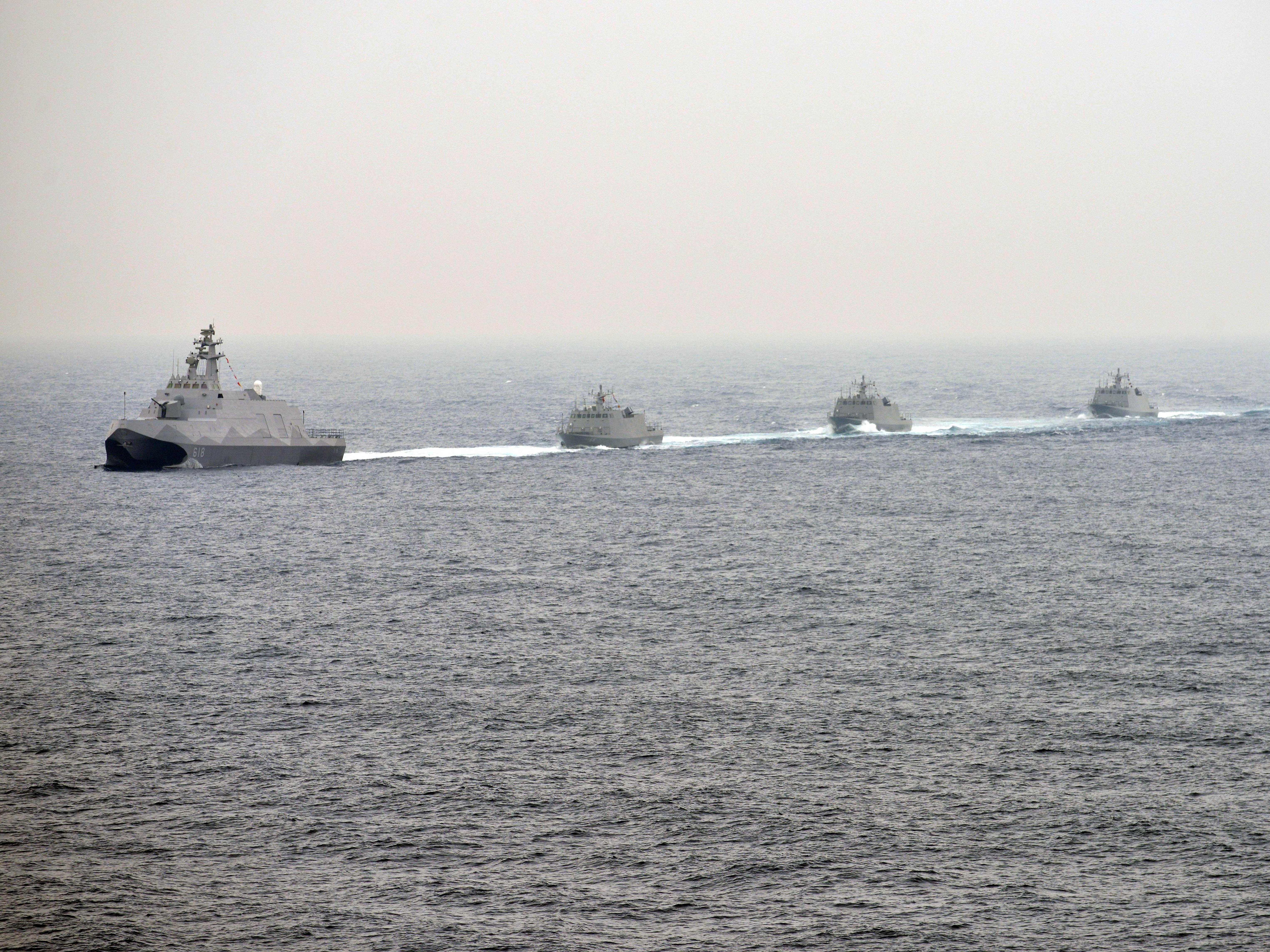 caption: Naval vessels participate in a Taiwanese military drill near the naval port in Kaohsiung in southern Taiwan on Jan. 27, 2016.