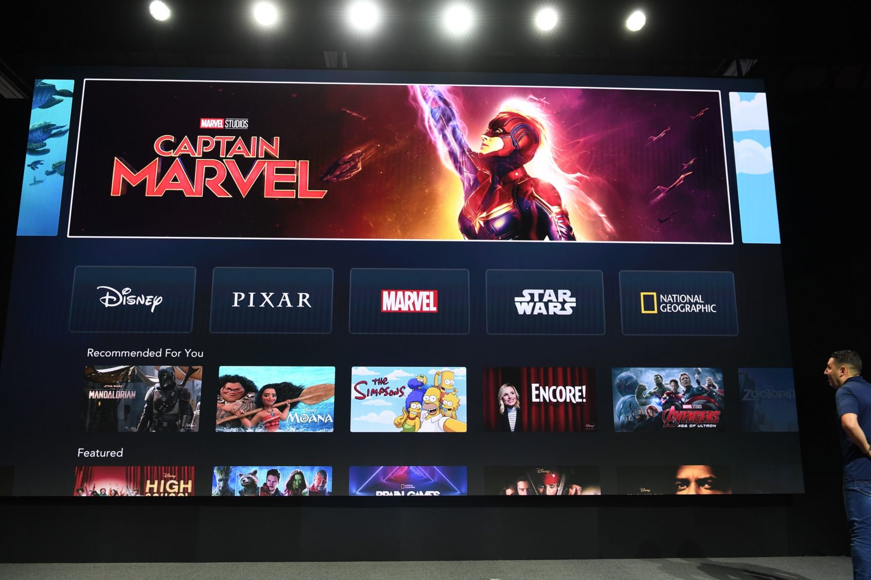 caption: The interface of Disney+ streaming service is displayed on Apple Inc.'s AppleTV at the D23 Expo, billed as the "largest Disney fan event in the world," on Aug. 23, 2019 at the Anaheim Convention Center in Anaheim, Calif. (Robyn Beck/AFP via Getty Images)