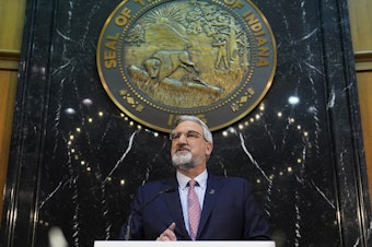 caption: Indiana Gov. Eric Holcomb delivers his State of the State address to a joint session of the legislature at the Statehouse, Tuesday, Jan. 11, 2022, in Indianapolis.