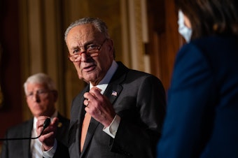 caption: Senate Majority Leader Chuck Schumer and West Virginia Democrat Joe Manchin struck a deal to include energy and climate spending in a party-line reconciliation bill.
