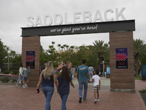 caption: Congregants arrive at Saddleback Church in Lake Forest, Calif. The megachurch founded by Rick Warren was one of two churches affected by a vote Wednesday at the Southern Baptist Convention's annual meeting.