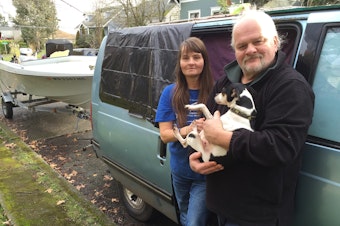 caption: Terry, Suzette and their dog Lulu live in a van in Ballard. They store their belongings in an SUV, and they tow a boat.