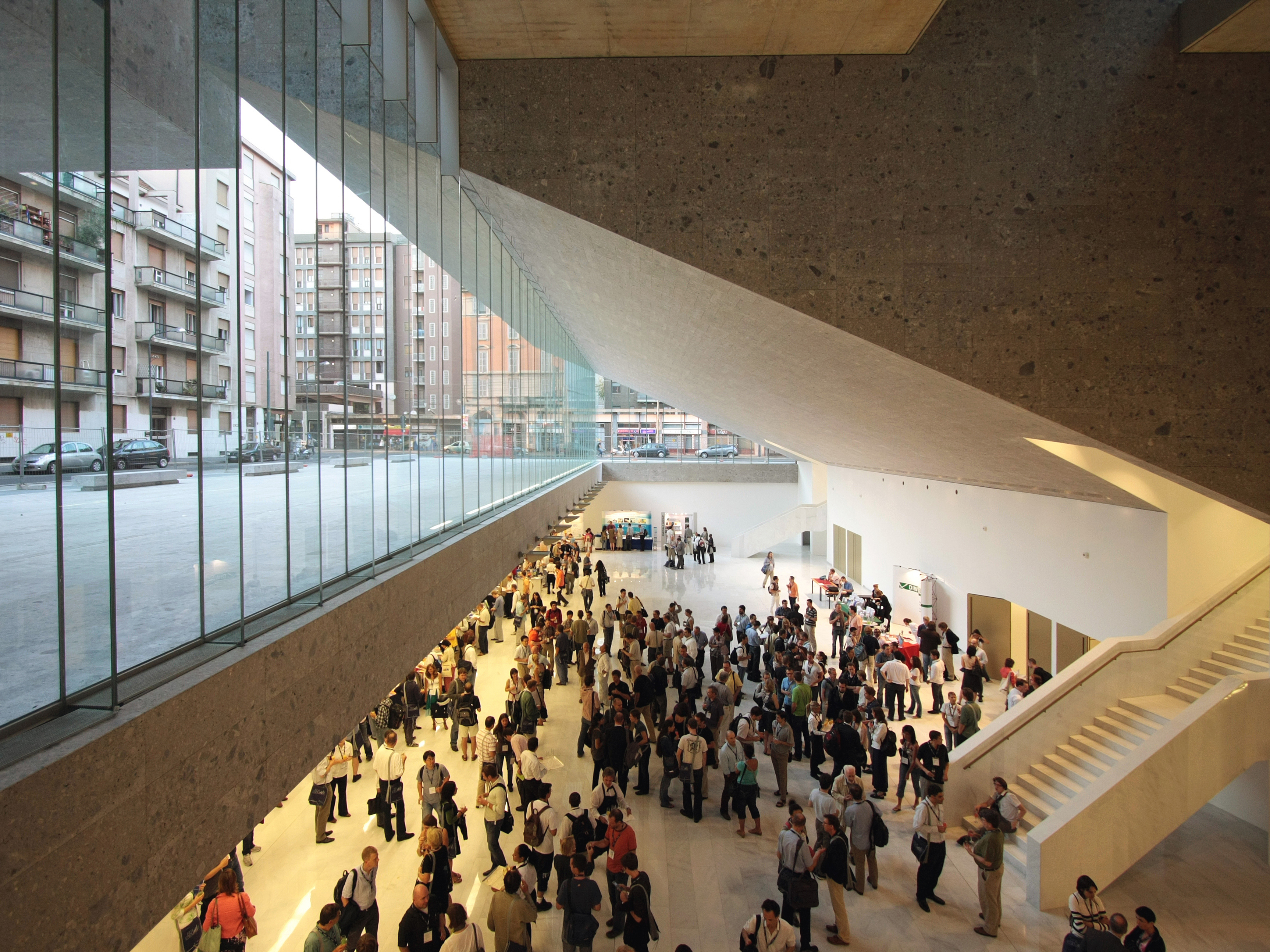 caption: The School of Economics Building at the Universita Luigi Bocconi in Milan, Italy, was designed by Grafton Architects — founded by Yvonne Farrell and Shelley McNamara. It launched Grafton Architects as a leading designer of university buildings.