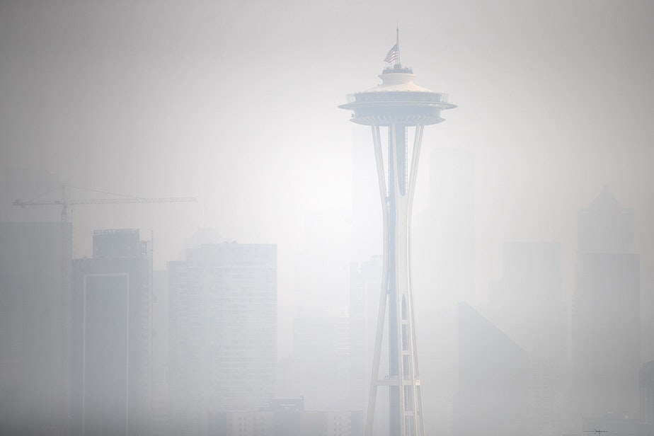 caption: The Space Needle, shown from Kerry Park, is shrouded in a massive plume of smoke from wildfires burning in California and Oregon on Friday, September 11, 2020, in Seattle.