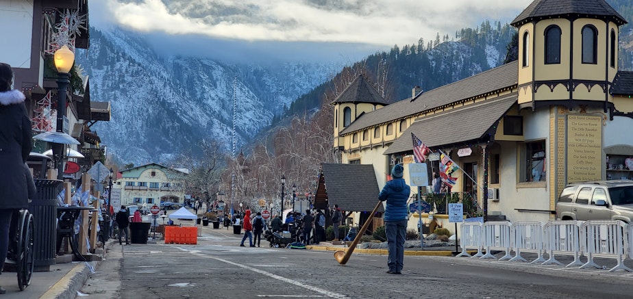 caption: Leavenworth resident Janet Mano plays the alphorn in downtown Leavenworth.