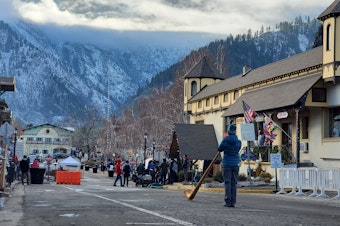 caption: Leavenworth resident Janet Mano plays the alphorn in downtown Leavenworth.
