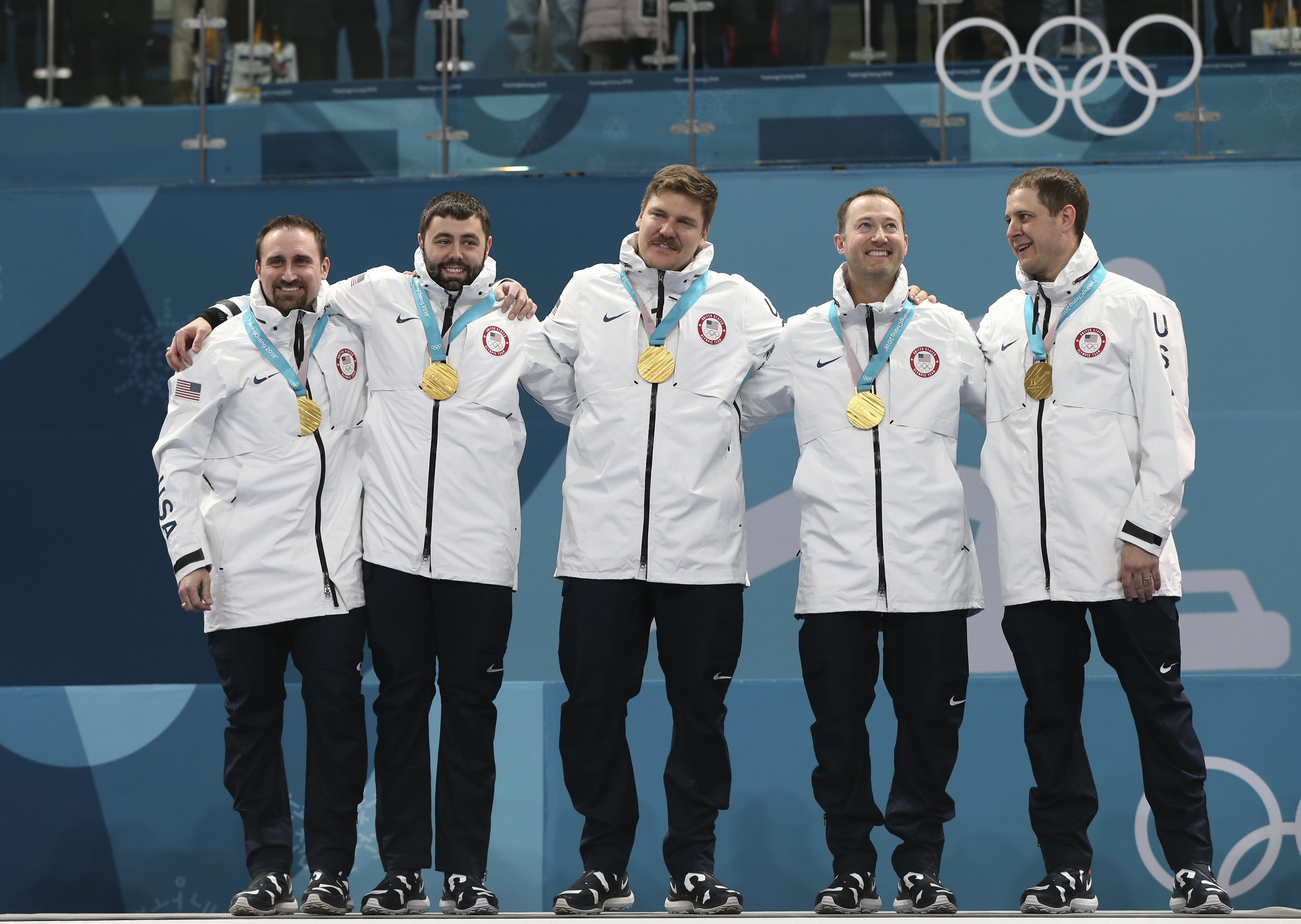caption: FILE - In this Feb. 24, 2018, file photo, the United States team poses with their gold medals after winning the men's final curling match against Sweden at the 2018 Winter Olympics in Gangneung, South Korea.