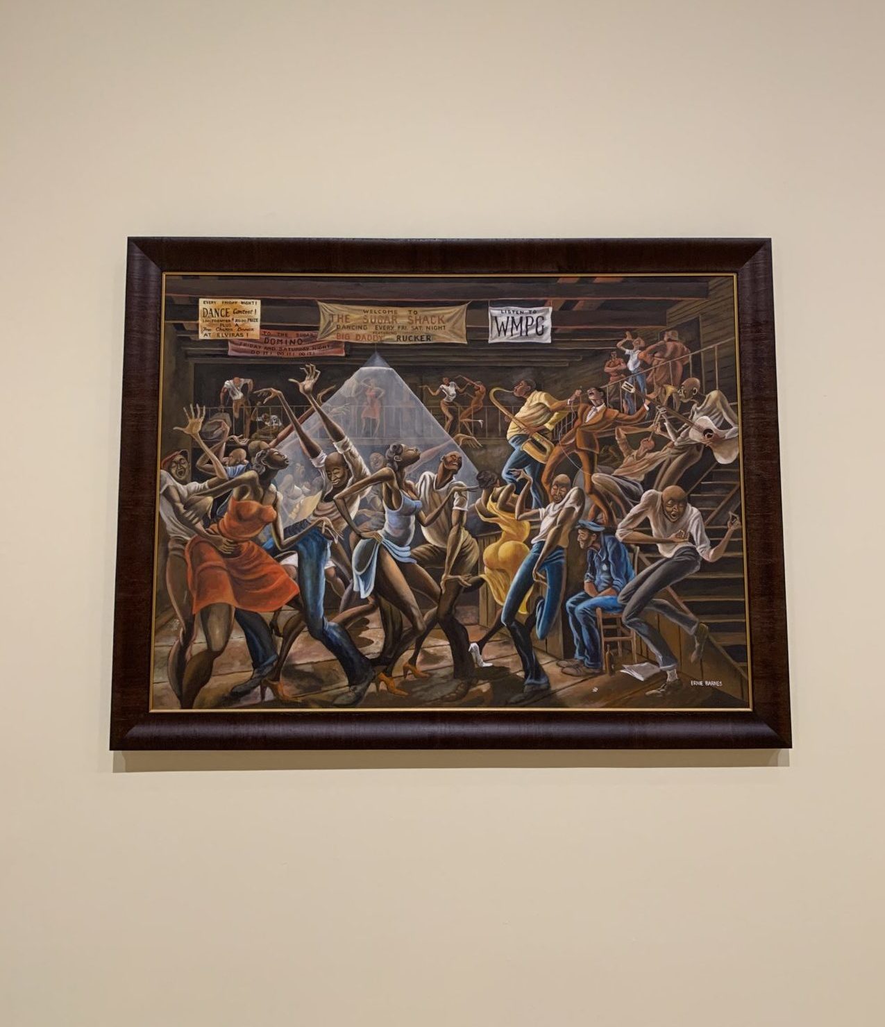 caption: A closeup on the "Sugar Shack" painting by the late artist Ernie Barnes. (Tonya Mosley/Here & Now)