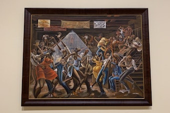 caption: A closeup on the "Sugar Shack" painting by the late artist Ernie Barnes. (Tonya Mosley/Here & Now)