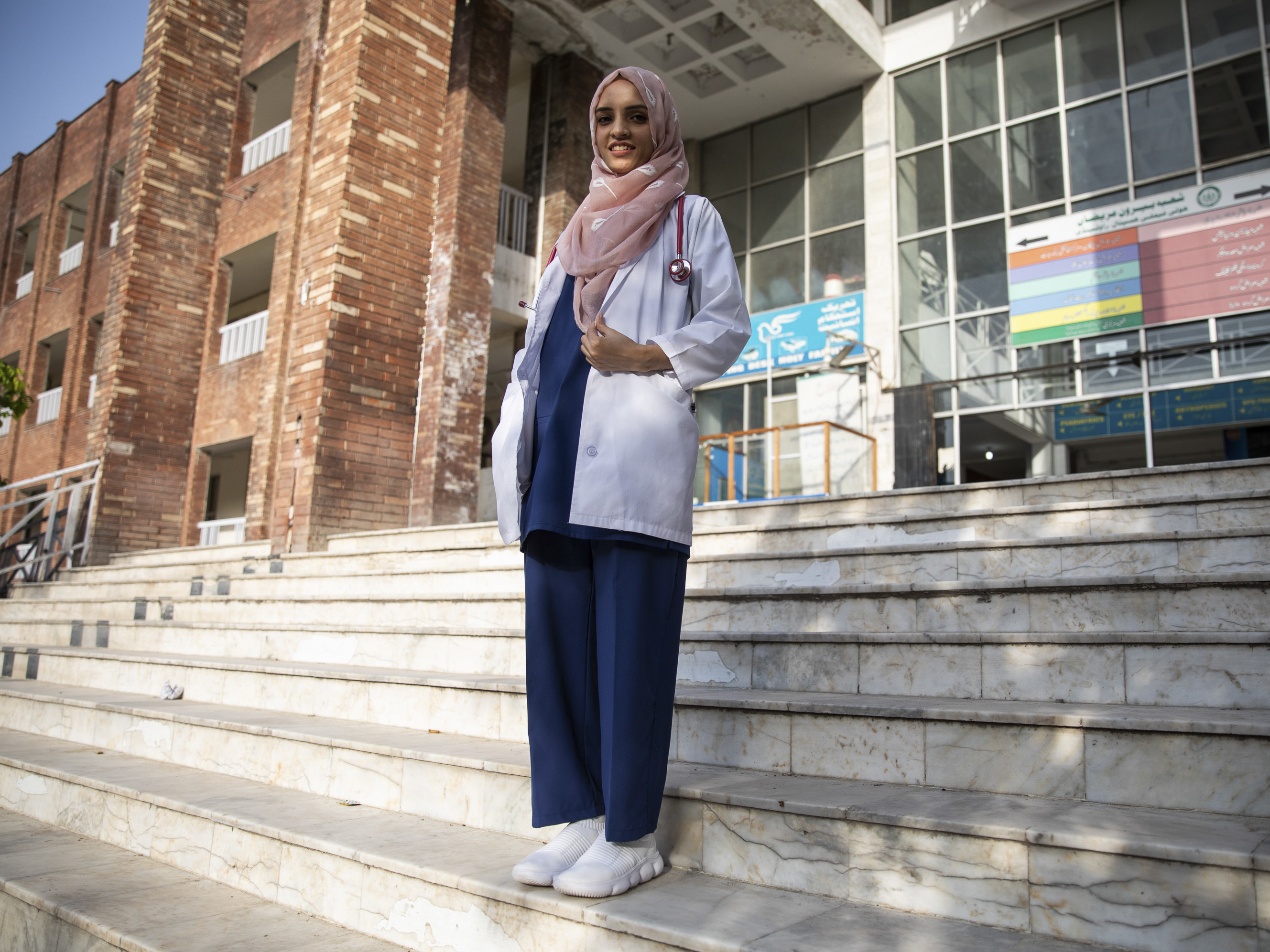 caption: Dr. Saleema Rehman stands outside Holy Family Hospital in Rawalpindi, Pakistan. The Afghan refugee of Turkmen origin has won UNHCR's Nansen Award for her work helping refugee moms and babies in Pakistan.