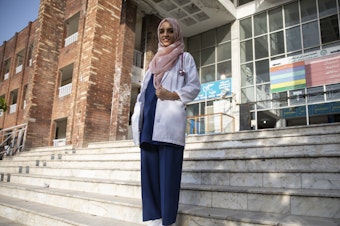caption: Dr. Saleema Rehman stands outside Holy Family Hospital in Rawalpindi, Pakistan. The Afghan refugee of Turkmen origin has won UNHCR's Nansen Award for her work helping refugee moms and babies in Pakistan.