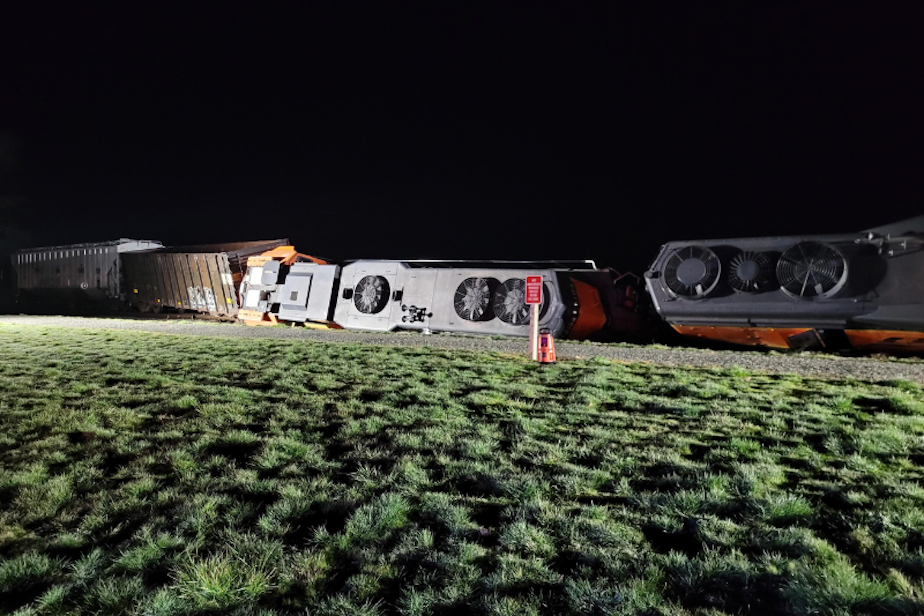 caption: Two derailed locomotives and a partially derailed buffer car on the Swinomish Reservation on March 16, 2023. 