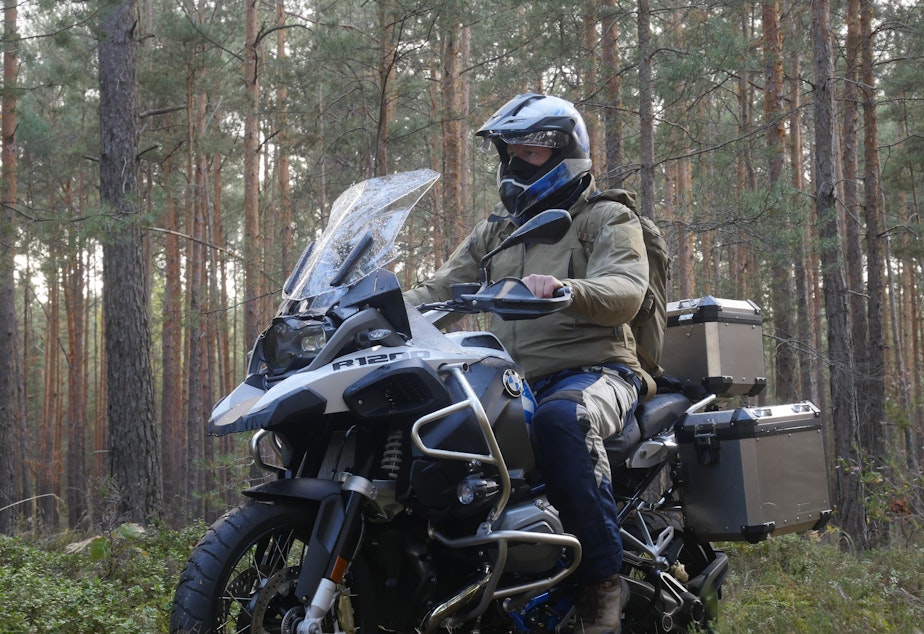 caption: Chris Morgan rode his motorcycle from Poland into Germany following the path of the wolves.