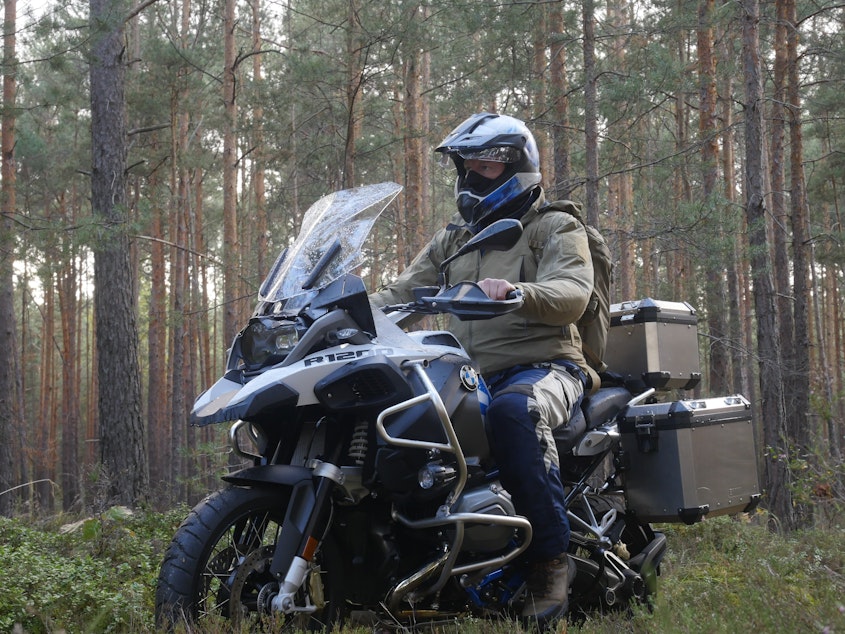 caption: Chris Morgan rode his motorcycle from Poland into Germany following the path of the wolves.