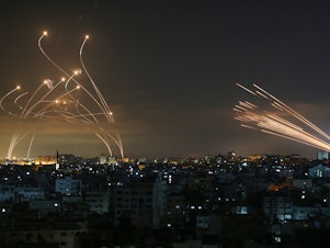 caption: The Iron Dome intercepts rockets fired by Hamas in May, 2021.