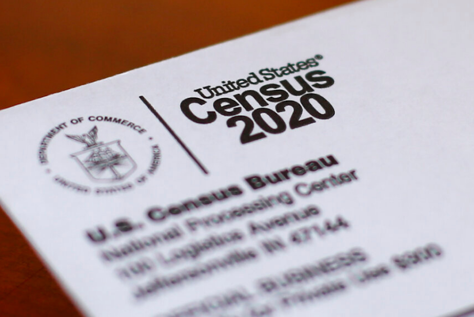 caption: This Sunday, April 5, 2020, photo shows an envelope containing a 2020 census letter mailed to a U.S. resident in Detroit. 