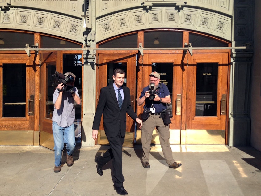 caption: Former WA State Auditor Troy Kelley leaves court during his first trial which ended in 2016 with the jury deadlocking on most charges and acquitting him of one. Kelley was later retried and convicted on several counts. He's now exhausted his appeals.