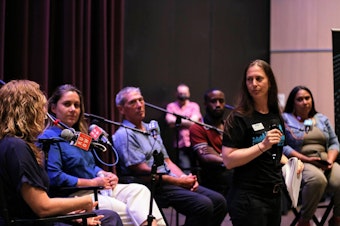 caption: A group of panelists take questions at KUOW's Unpack the Story event on Wednesday, Aug. 3, 2022 at the Seattle Public Library in downtown Seattle. From left to right: Dr. Taryn Hansen, Lara Okoloko, Johnny Ohta, Deaunte Damper, Anna Boiko-Weyrauch, and Malika Lamont.
