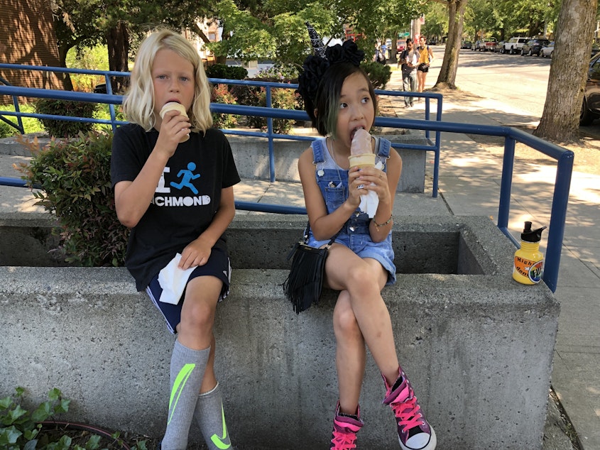 caption: Walter Hecht and Ash Arrogante enjoying their soft serve cones in Seattle's Madrona neighborhood.