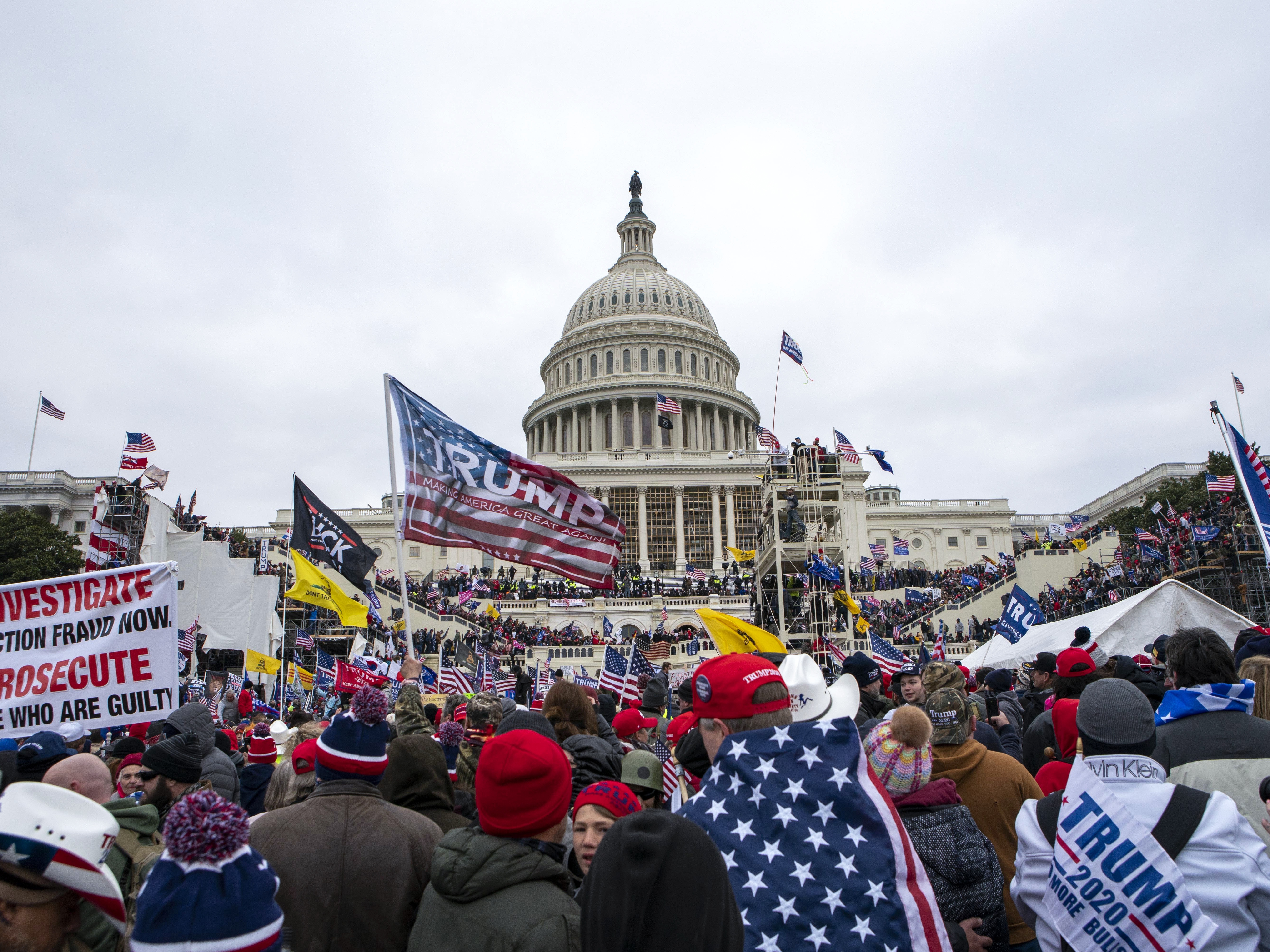 caption: Rioters loyal to President Donald Trump rally at the U.S. Capitol in Washington on Jan. 6, 2021.