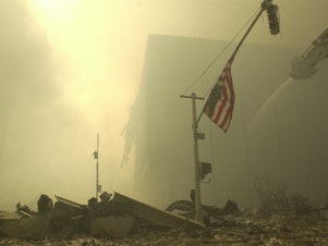 caption: An American flag at ground zero on the evening of Sept. 11, 2001, after the terrorist attacks on the World Trade Center in New York City.