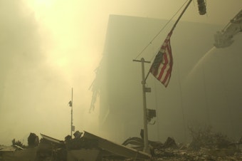 caption: An American flag at ground zero on the evening of Sept. 11, 2001, after the terrorist attacks on the World Trade Center in New York City.