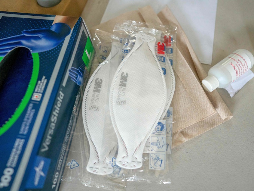 caption: Hospitals are facing widespread shortages of personal protective equipment, or PPE, for health care workers. A Columbia University alumni association is raising money to purchase much needed N95 masks, seen here, gowns and other gear.