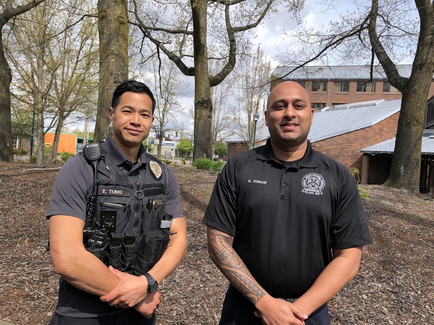 caption: Kent recruiter Sgt. Eric Tung, left, and one of the agency's newest officers, Krishan Kumar. Kumar said he applied to work in Kent because his family lives there and it's a diverse city. His ability to speak Hindi got him a salary increase.