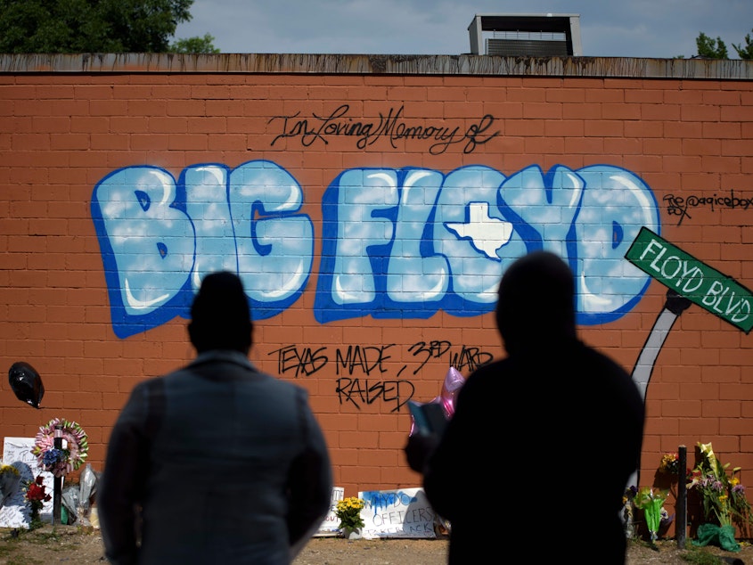 caption: A mural memorializes George Floyd is his hometown of Houston, where he was known as Big Floyd, and part of the city's hugely influential Screwed Up Click rap collective.