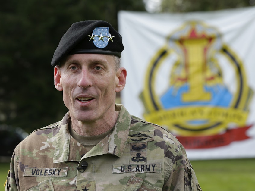 caption: U.S. Army Lt. Gen. Gary Volesky talks to reporters following a change of command ceremony at Joint Base Lewis-McChord in Washington state on April 3, 2017. The Army has suspended Volesky over a recent tweet in response to the first lady.
