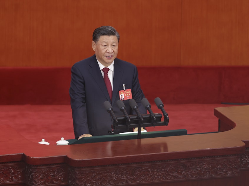 caption: Chinese President Xi Jinping delivers a speech during the opening session of the 20th National Congress of the Communist Party of China on Sunday in Beijing.