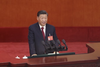 caption: Chinese President Xi Jinping delivers a speech during the opening session of the 20th National Congress of the Communist Party of China on Sunday in Beijing.