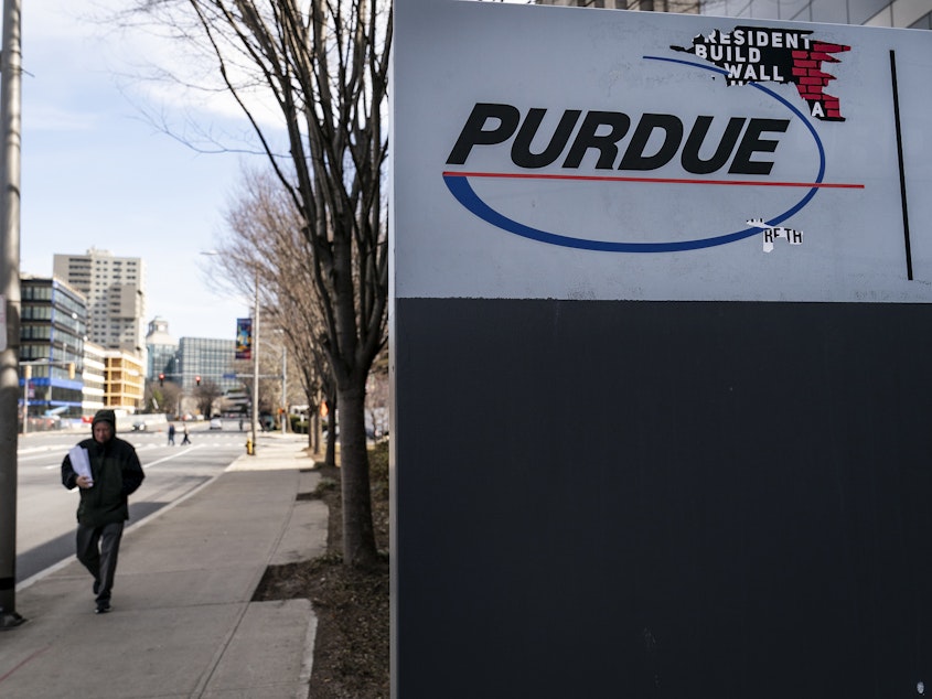 caption: Signage for Purdue Pharma headquarters stands in downtown Stamford, April 2, 2019 in Stamford, Connecticut. Purdue Pharma, the maker of OxyContin, and its owners, the Sackler family, are facing hundreds of lawsuits across the country for the company's alleged role in the opioid epidemic that has killed more than 200,000 Americans over the past 20 years.