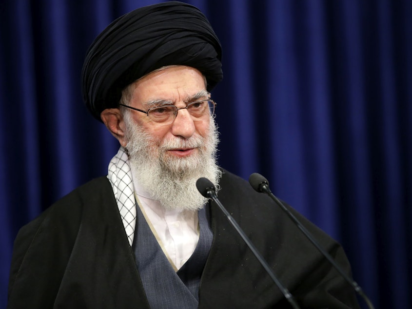 caption: Iranian Supreme Leader Ayatollah Ali Khamenei on Jan. 8. A Twitter account believed to be linked to Khamenei was permanently banned Friday after posting a threatening image involving former President Donald Trump. Twitter told The Associated Press the account was a fake.